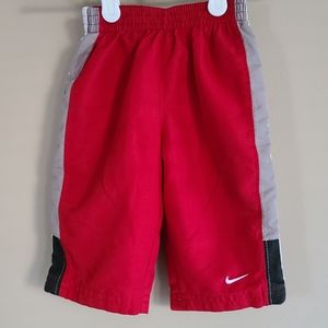 NIKE red lined splash pants